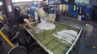 Powder benig loaded into mold, Rotomolding materials being loaded